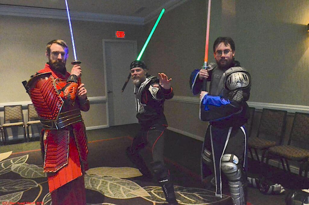 Picture of cosplayers using lightsabers