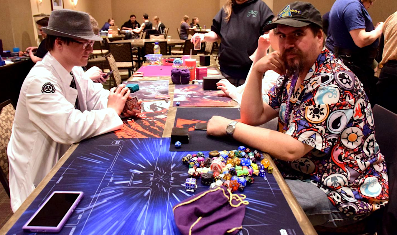 image of Matthew Hellendrung and another man playing a table top game